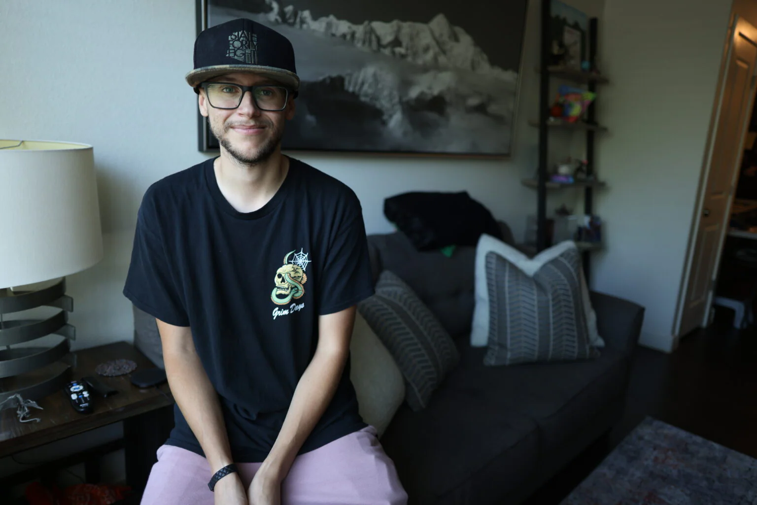 A resident relaxing at home in his own apartment