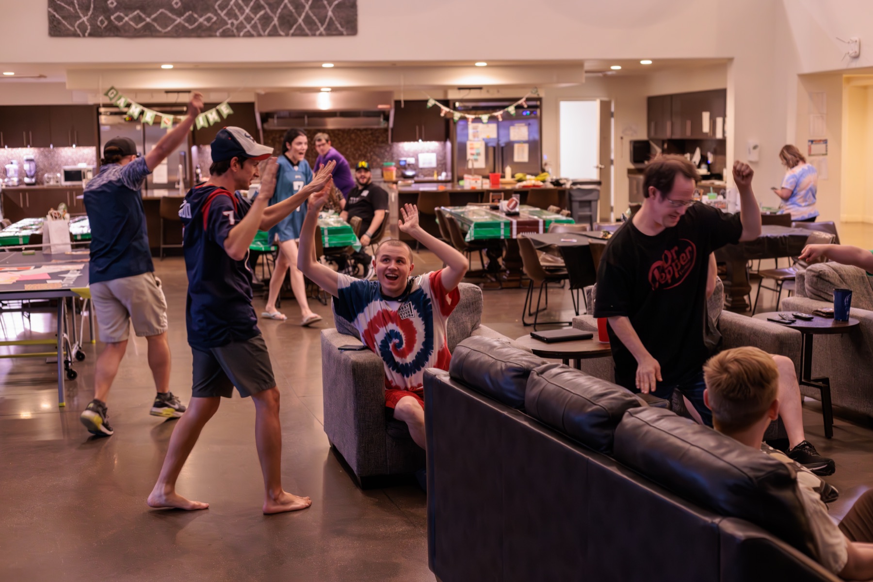 Residents celebrating together in the Treasure House common room
